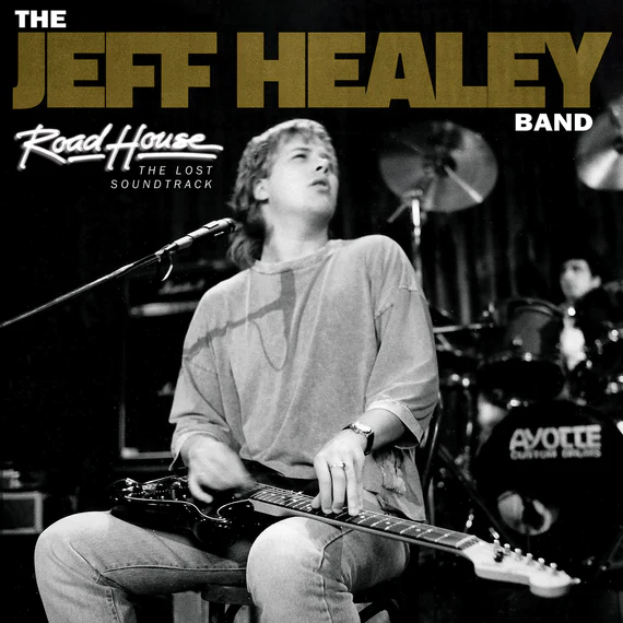 "Road House: the Lost Soundtrack" by The Jeff Healey Band featuring Canadian jazz guitarist, Jeff Healey, seated while playing his guitar.